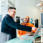 two people working on a computer