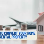 a house on a table with money on it and a rental property