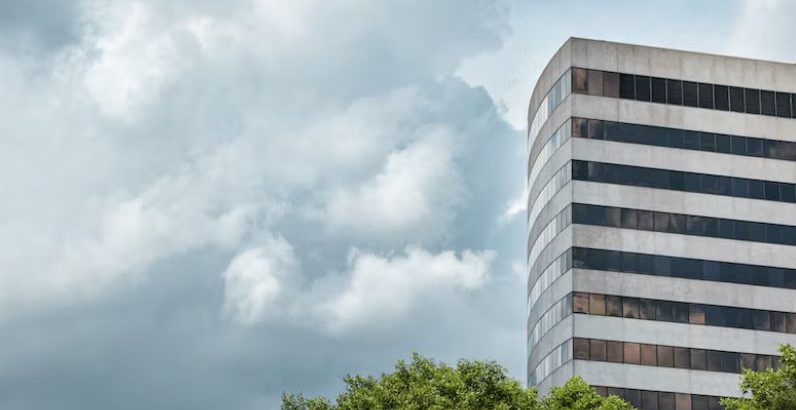 an office building next to a tree