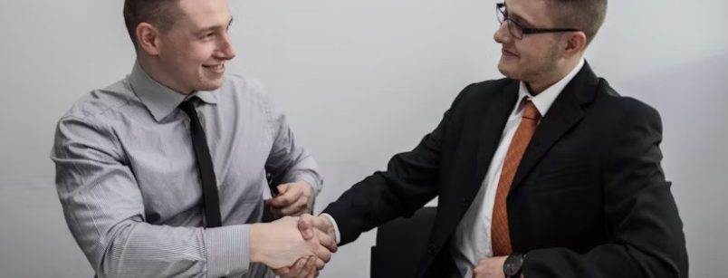 two real estate agents shaking hands